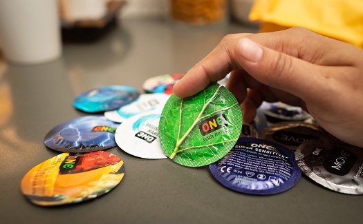 Several One condoms on the counter