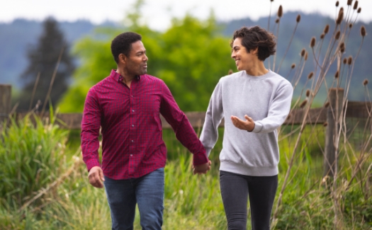 couple talking in a field in southern Oregon
