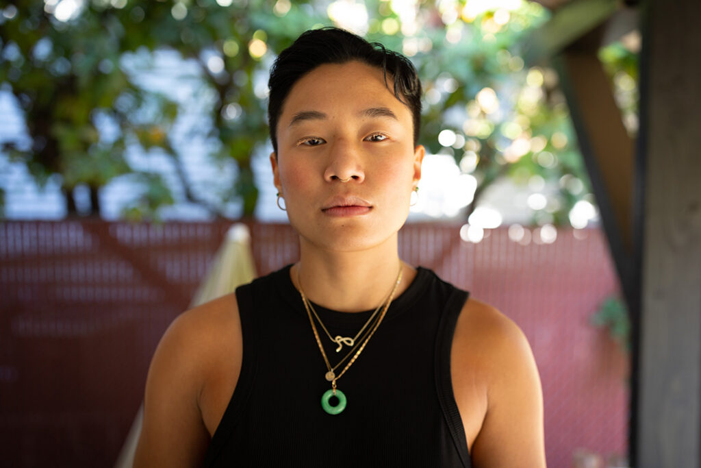 Portrait of an Asian woman with a facial piercing